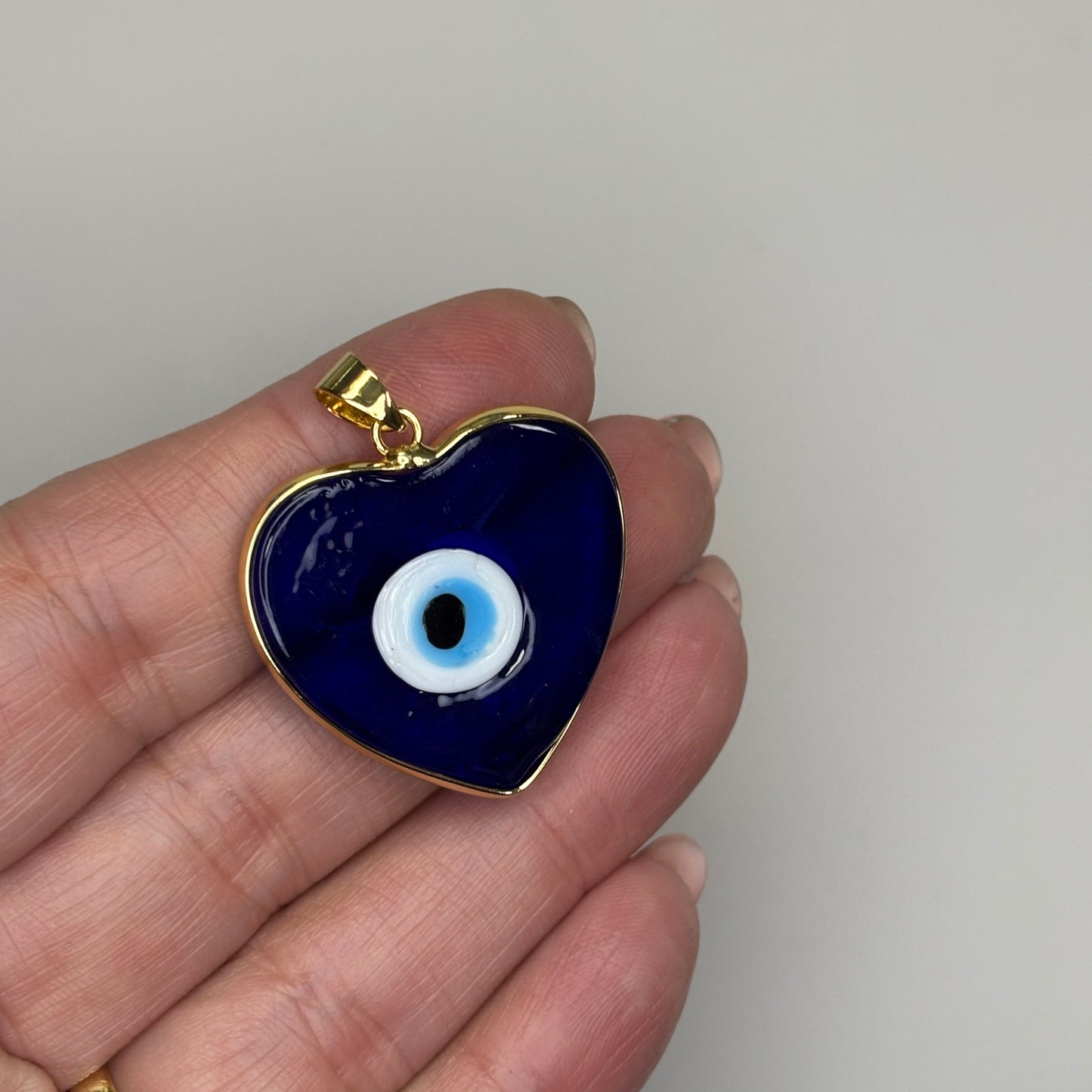 GLASS GOLD TRIM EVIL RYE HEART NAVY CHARM PENDANT
