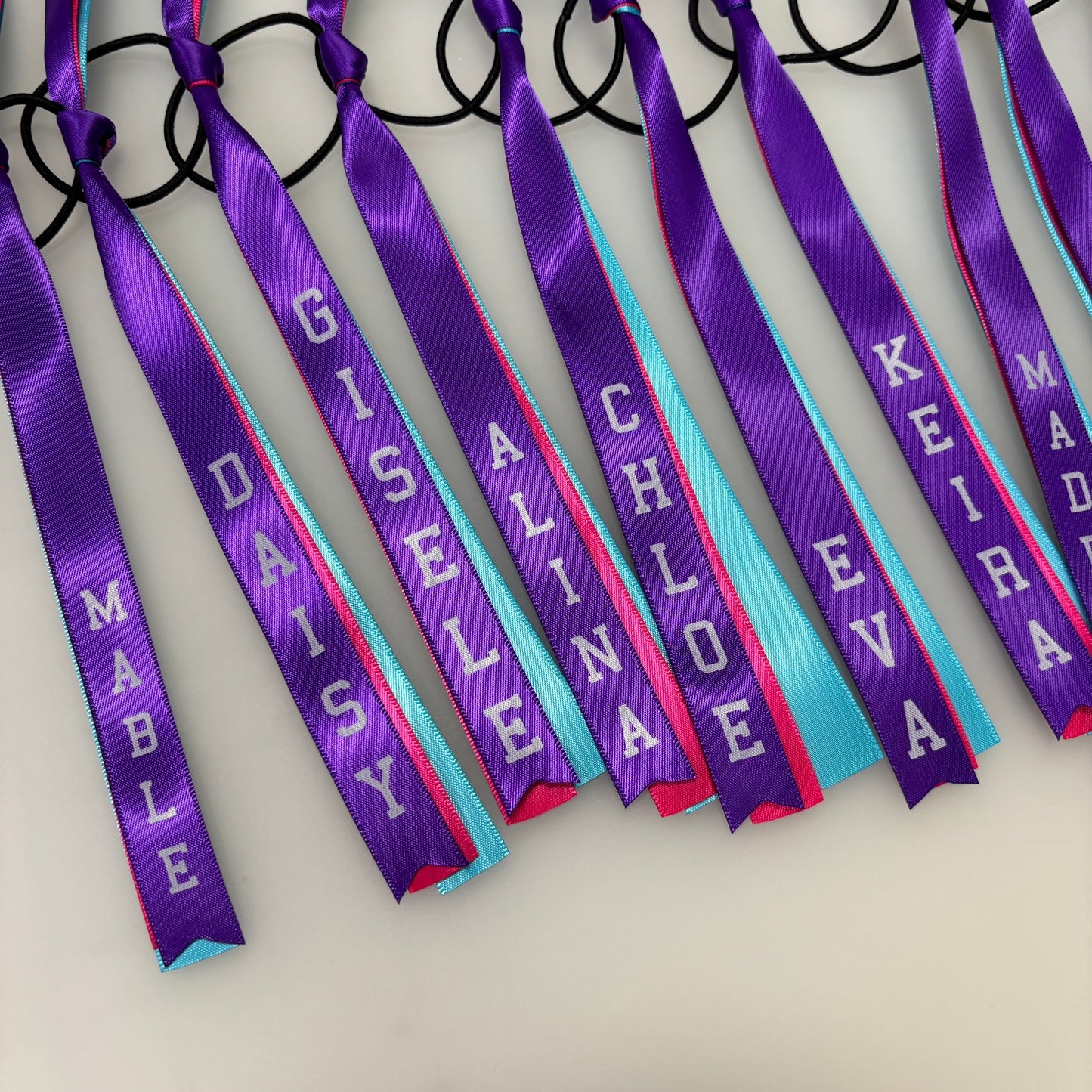 TEAM HAIR RIBBONS 3 COLOURS 15MM VERTICAL COLLEGE FONT