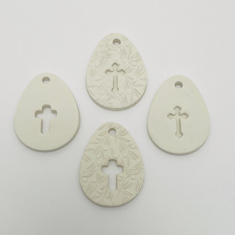 WHITE CLAY EGG WITH CUT OUT CROSS OR CROSS