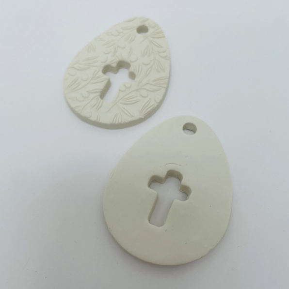 WHITE CLAY EGG WITH CUT OUT CROSS OR CROSS