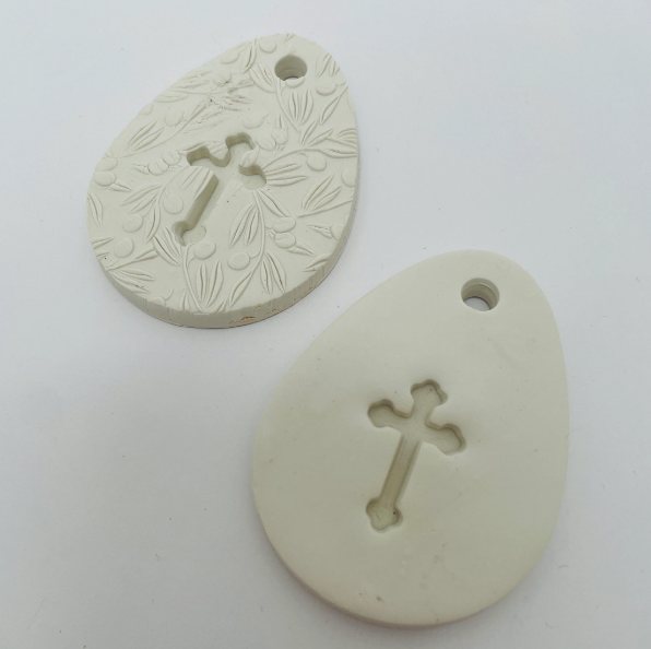 WHITE CLAY EGG WITH CUT OUT CROSS OR CROSS