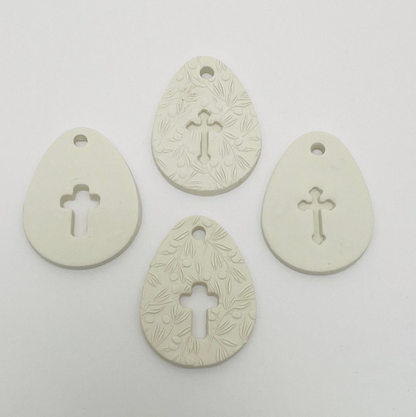 WHITE CLAY EGG WITH CUT OUT CROSS OR CROSS