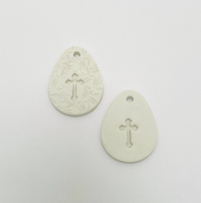 WHITE CLAY EGG WITH CUT OUT CROSS OR CROSS
