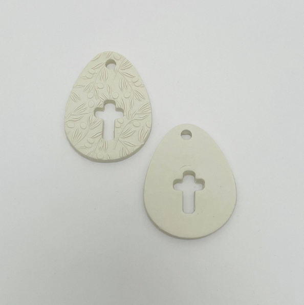 WHITE CLAY EGG WITH CUT OUT CROSS OR CROSS