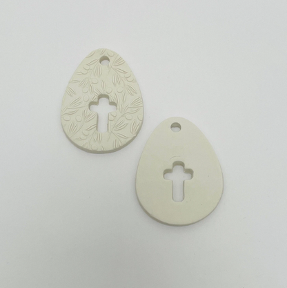 WHITE CLAY EGG WITH CUT OUT CROSS OR CROSS