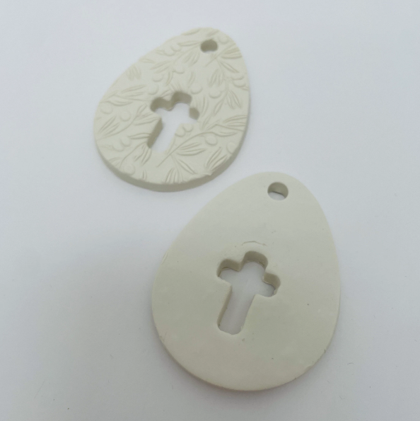 WHITE CLAY EGG WITH CUT OUT CROSS OR CROSS
