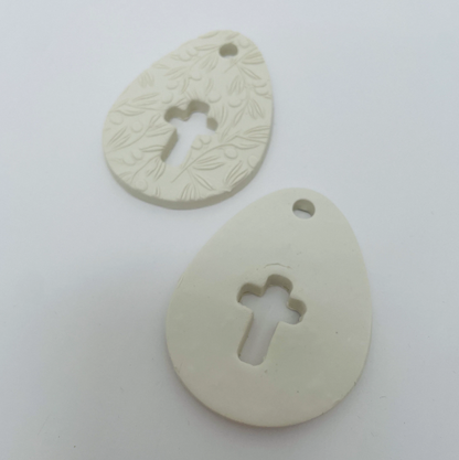 WHITE CLAY EGG WITH CUT OUT CROSS OR CROSS