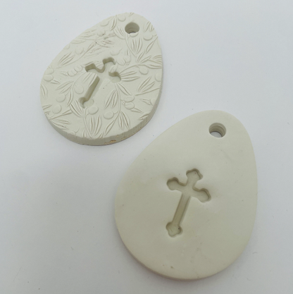 WHITE CLAY EGG WITH CUT OUT CROSS OR CROSS