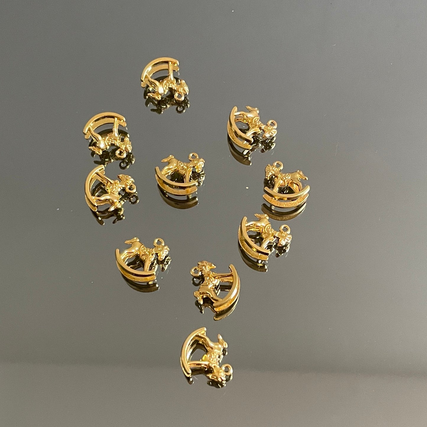 10 X GOLD ROCKING HORSE CHARMS